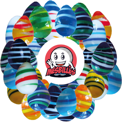 Image de la Mascotte MesBilles entourée de Billes Oeuf MesBilles, opaque bleue rayée de jaune, environ 25mm de hauteurBilles Oeuf MesBilles, opaque bleue rayée de jaune, environ 25mm de hauteur