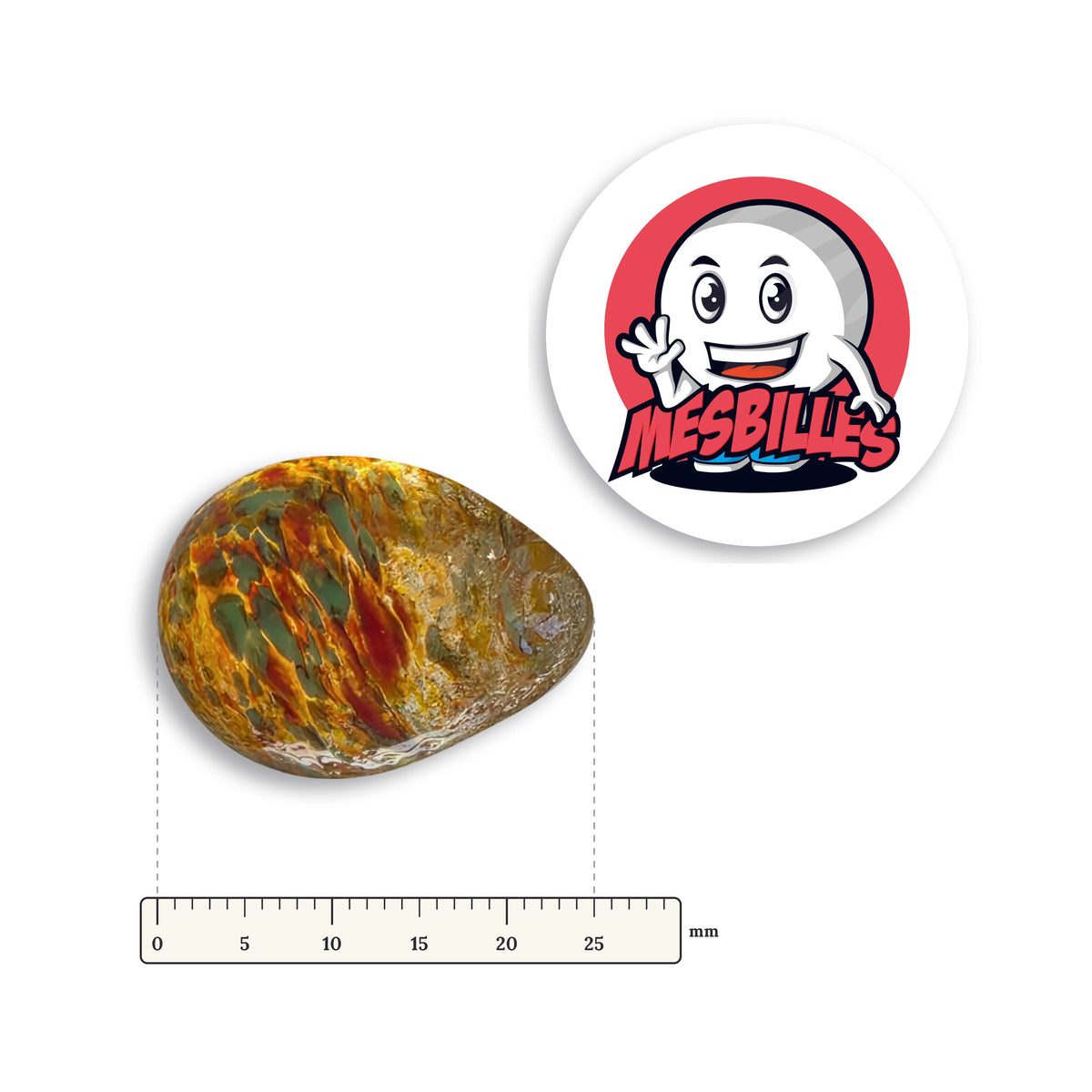Bille Oeuf Ambre Moucheté Vert et Orange couchée à côté d'une règle graduée, environ 25 mm de long