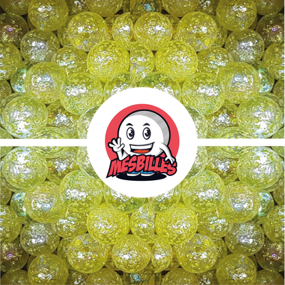 Image de la Mascotte MesBilles entourée de Billes Pépite en verre translucide avec éclats JAUNE 25 mm